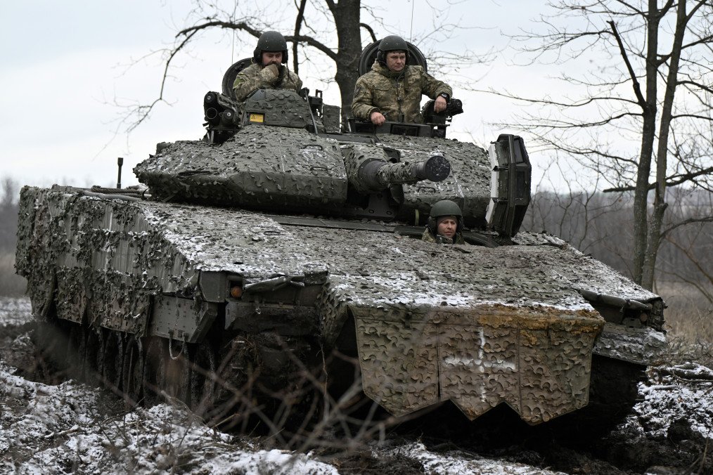 Ukrainian servicemen inspect their Swedish-made CV90 armored infantry combat vehicle on a position overlooking Bakhmut in the Donetsk region on November 27, 2023. (Source: Getty Images) Ukrainian servicemen inspect their Swedish-made CV90 armored infantry combat vehicle on a position overlooking Bakhmut in the Donetsk region on November 27, 2023. (Source: Getty Images)