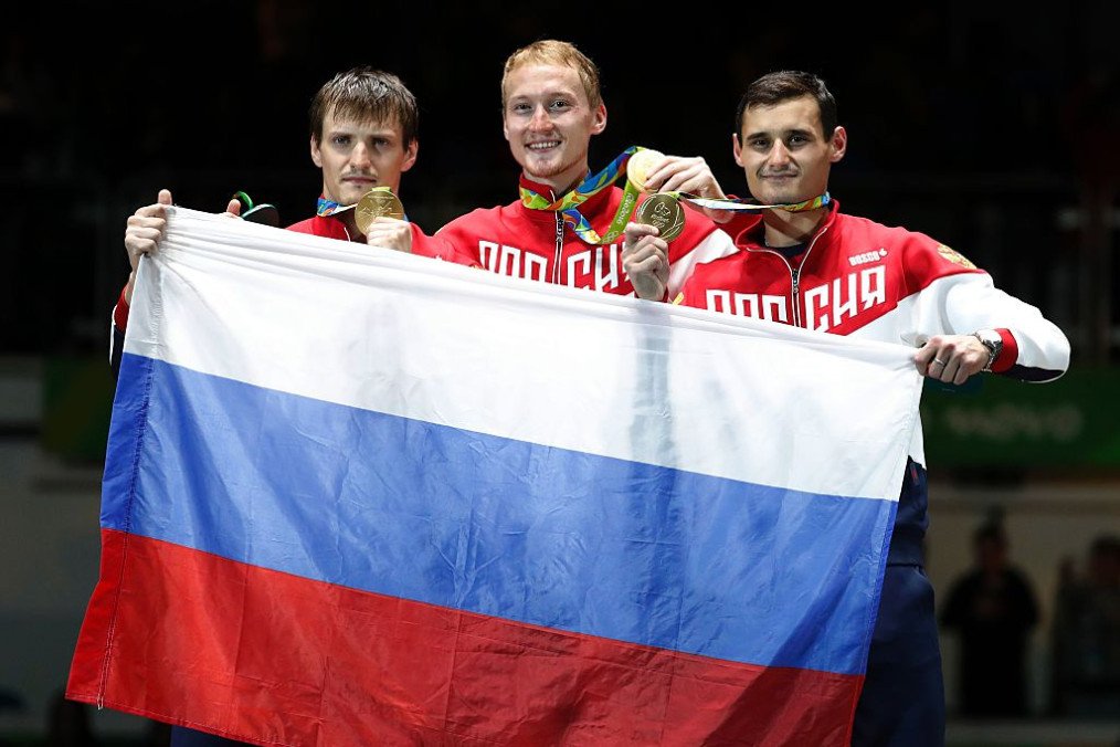 Illustrative image: Russia’s team pose with their gold medals on the podium atfer the mens team foil fencing event of the Rio 2016 Olympic Games, on August 12, 2016, at the Carioca Arena 3, in Rio de Janeiro. (Source: Getty Images)