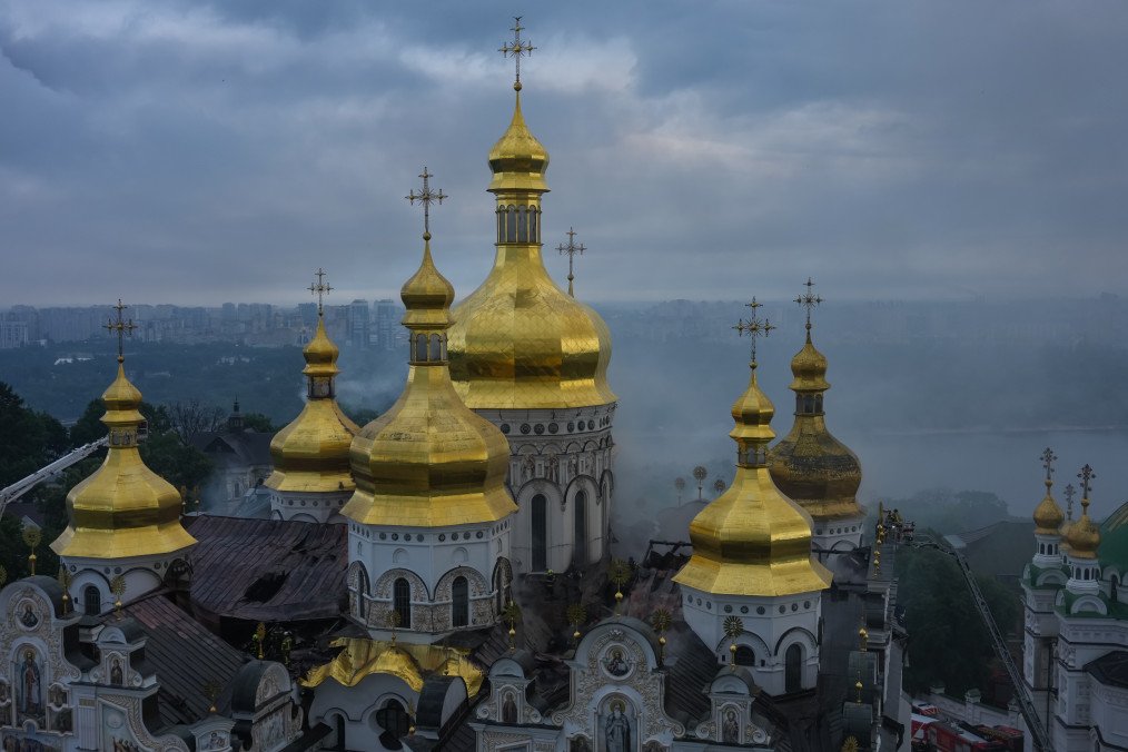 Switzerland Allocates $730K With UNESCO to Restore Strike-Damaged Kyiv-Pechersk Lavra After extinguishing the fire, firefighters inspect the damaged roof of the Dormition Cathedral of the Kyiv Pechersk Lavra (UNESCO World Heritage Site) hit by a Russian drone strike on June 15, 2026 in Kyiv, Ukraine. (Source: Getty Images)