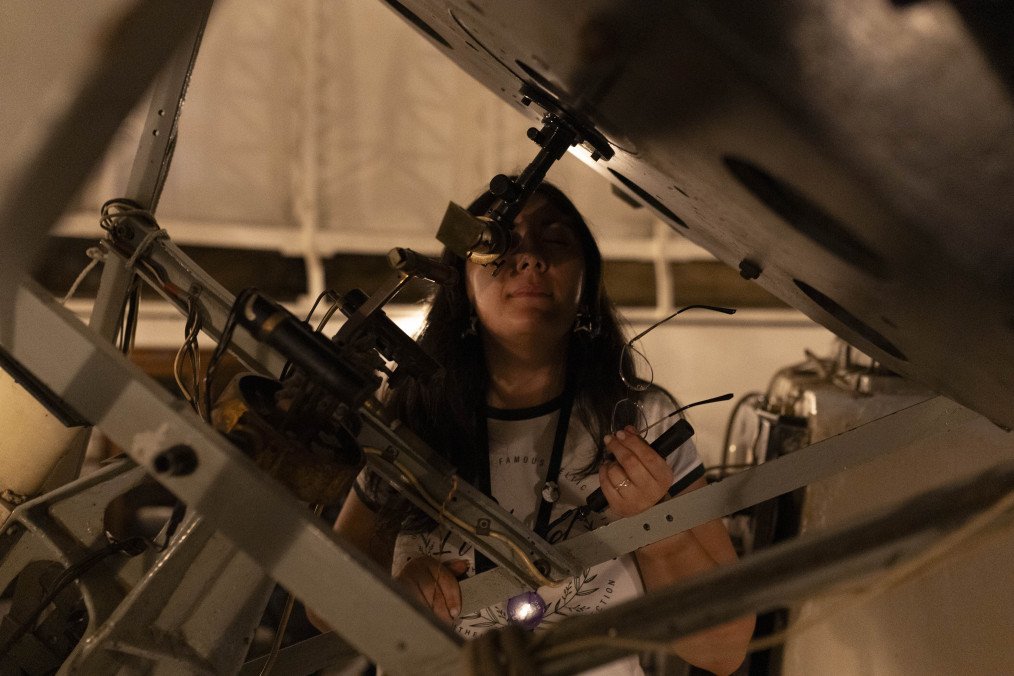 From War Zone to Space Lab: How Ukrainian 16-Year-Old Refugee Helps Develop Solar Power for Satellites in UK Astronomer Javiera Mesias views the total lunar eclipse from the Manuel Foster Observatory telescope in Santiago, Chile, on March 14, 2025. Illustrative photo. (Source: Getty Imges)