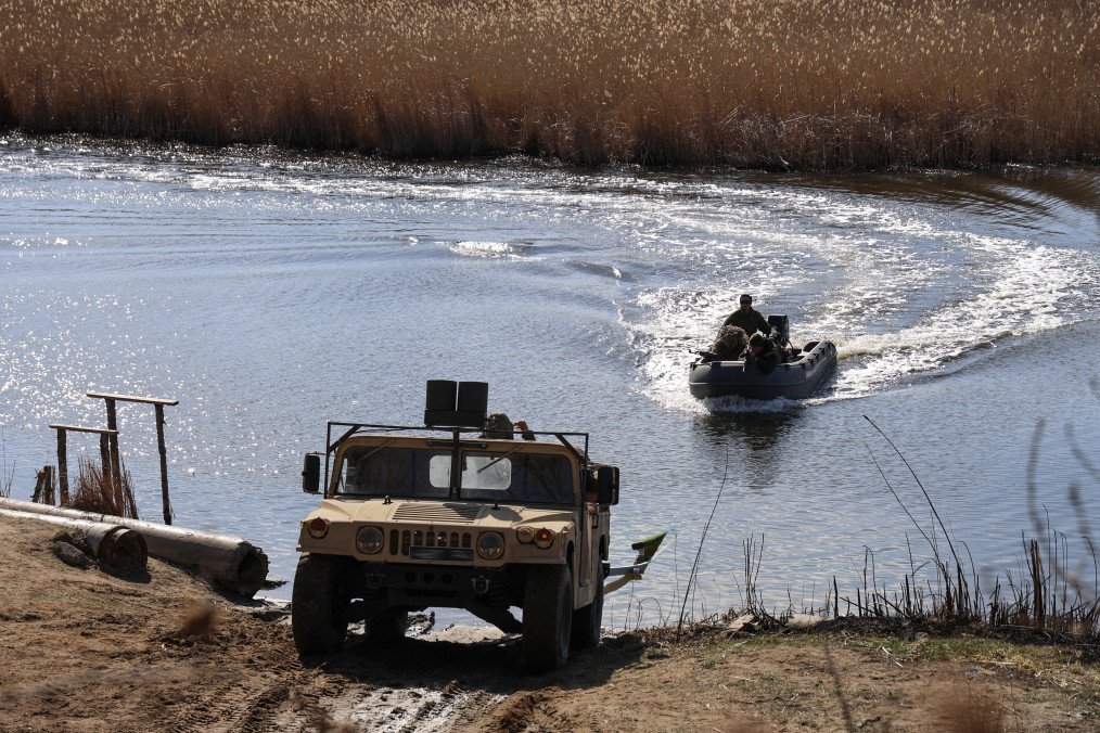 Ukrainian marines from the 40th Coastal Defense Brigade conduct landing drills with a Humvee near a water obstacle in southern Ukraine, March 21, 2025. Ukrainian marines from the 40th Coastal Defense Brigade conduct landing drills with a Humvee near a water obstacle in southern Ukraine, March 21, 2025.