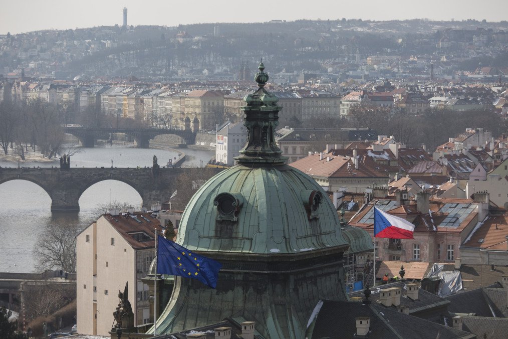 Westward views from Letna Park to the district of Hradcany and the Charles Bridge on the Vltava river where the EU and Czech flags fly over a government building. (Source: Getty Images)