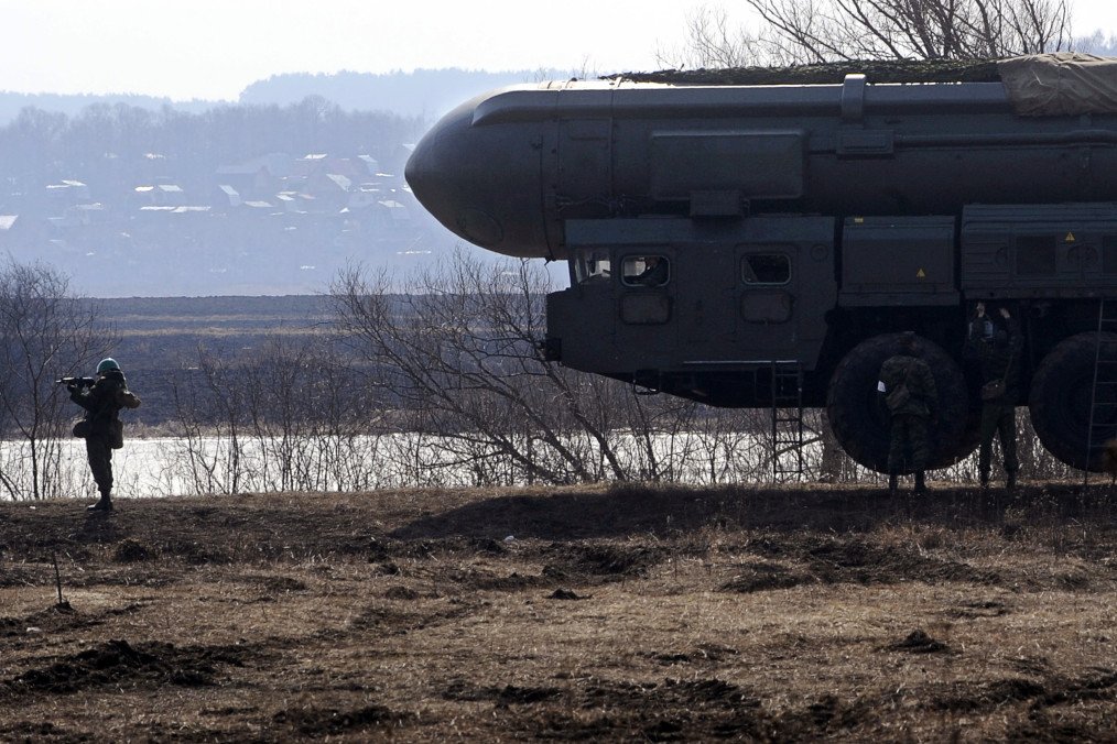 Russian soldier guards a model of Topol intercontinental ballistic missile during a training session at the Serpukhov military missile forces research institute outside Moscow on April 6, 2010. Russian soldier guards a model of Topol intercontinental ballistic missile during a training session at the Serpukhov military missile forces research institute outside Moscow on April 6, 2010.