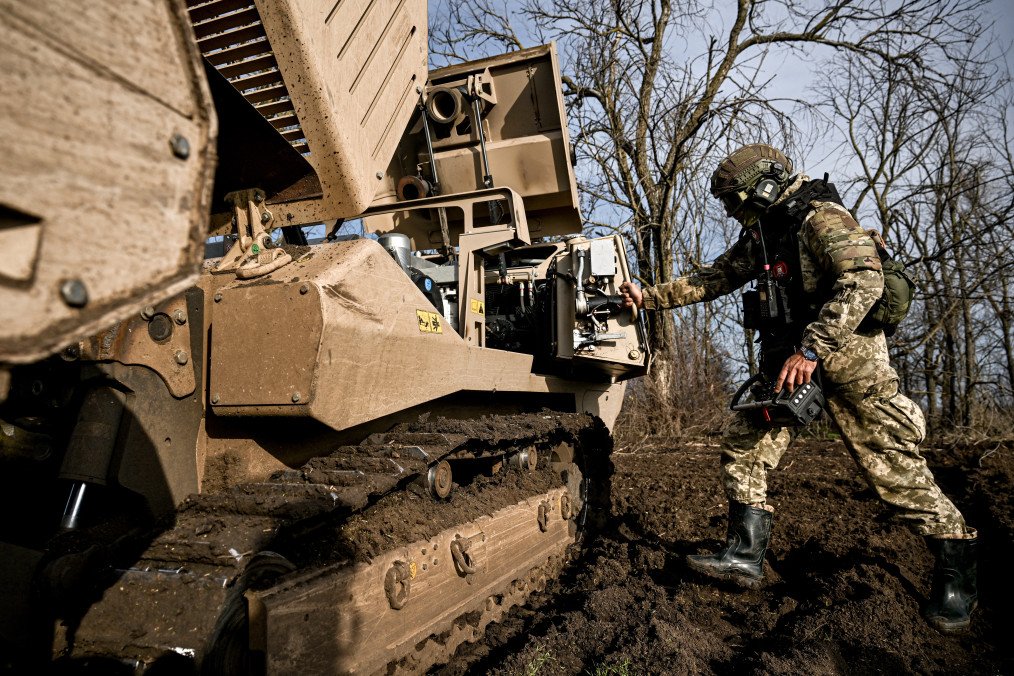 Australia Pledges Additional $100M in Military Aid to Ukraine for Critical Defense Support A demining operator of the 808th Dniester Separate Support Brigade of the Armed Forces of Ukraine works beside a GCS-200 mechanical demining machine in Kherson region, Ukraine, on November 22, 2025. (Source: Getty Images)