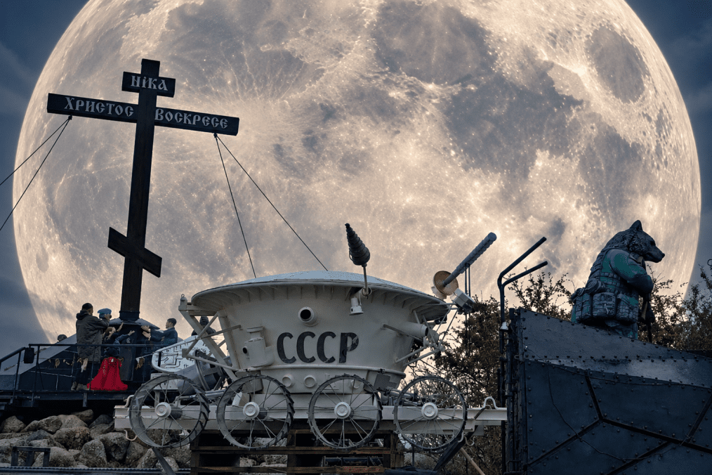 A Soviet-themed lunar rover display marked “USSR” stands beneath a large Orthodox cross in Izborsk, Russia, with the Moon added in the background. (Source: UNITED24 Media) A Soviet-themed lunar rover display marked “USSR” stands beneath a large Orthodox cross in Izborsk, Russia, with the Moon added in the background. (Source: UNITED24 Media)