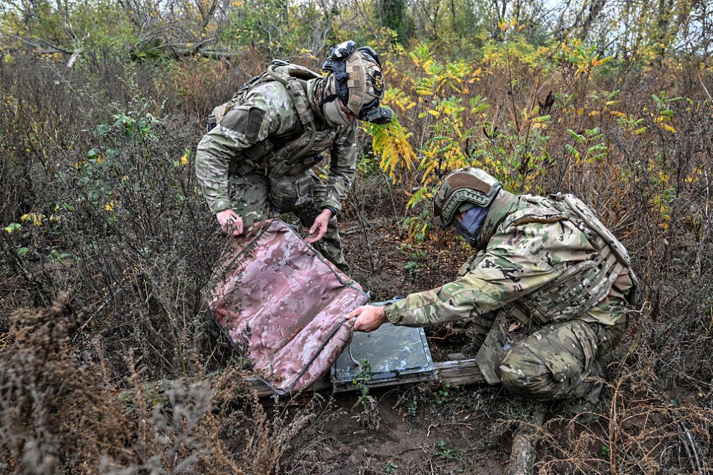 Soldiers from a separate task rifle battalion of the National Police of Ukraine remove a camouflage case from a Starlink satellite communication terminal in the Donetsk region, Ukraine, on October 16, 2026. (Source: Getty Images) Soldiers from a separate task rifle battalion of the National Police of Ukraine remove a camouflage case from a Starlink satellite communication terminal in the Donetsk region, Ukraine, on October 16, 2026. (Source: Getty Images)