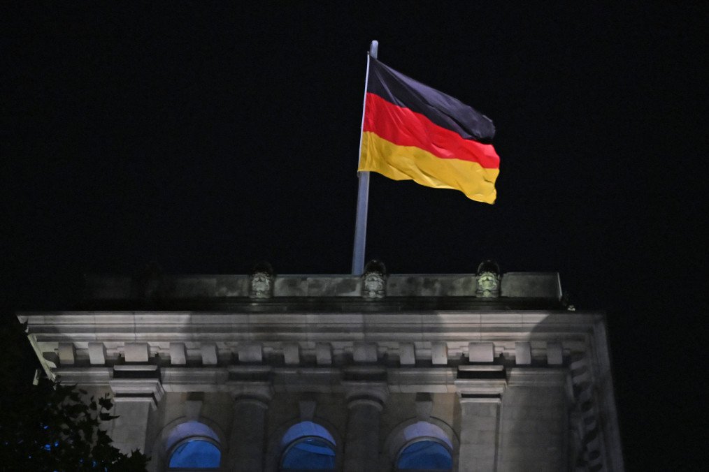 A German flag at the Reichstag building. (Source: Getty Images)