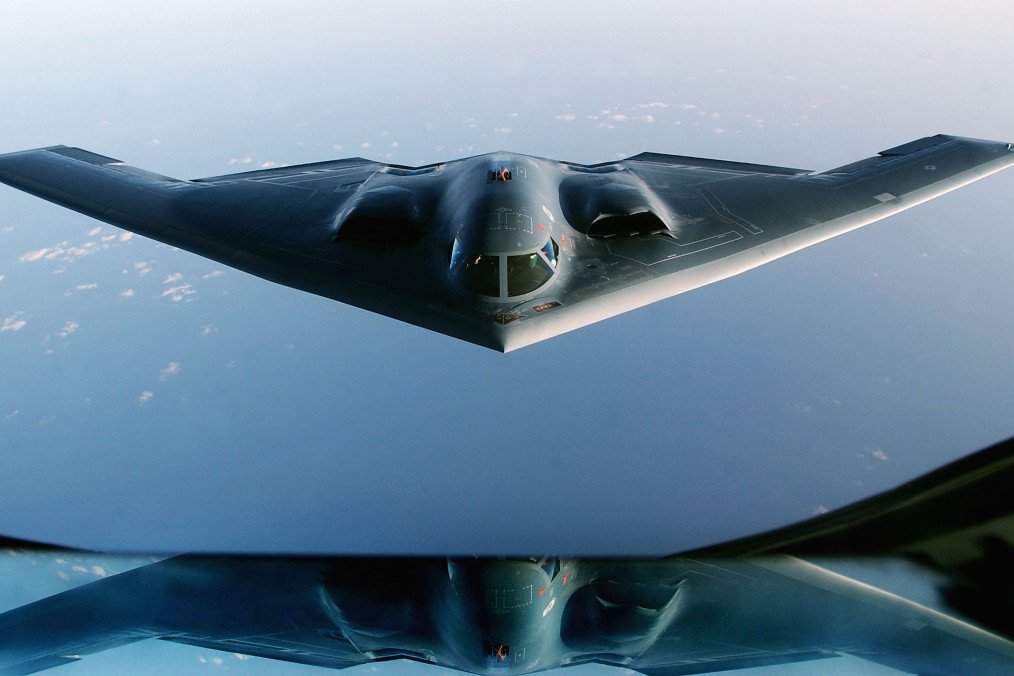 A US B-2 Spirit stealth bomber flies over the Indian Ocean after completing a mission during the Iraq War, March 27, 2003. (Source: Getty Images)