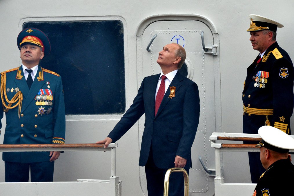 Russia’s leader, Vladimir Putin, and Defence Minister watch the Russian Air Force parade during their visit to the Crimean port of Sevastopol on May 9, 2014. (Source: Getty Images) Russia’s leader, Vladimir Putin, and Defence Minister watch the Russian Air Force parade during their visit to the Crimean port of Sevastopol on May 9, 2014. (Source: Getty Images)