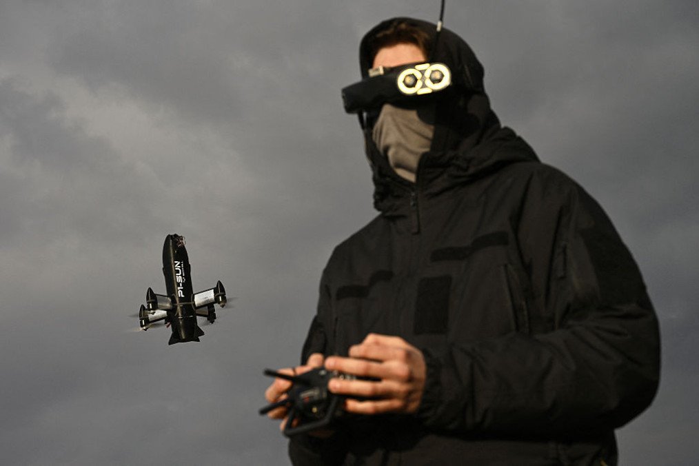 An employee of the Ukrainian SkyFall company conducts a test flight with a P1-Sun interceptor drone at an undisclosed location in Ukraine on March 19, 2026. (Source: Getty Images)