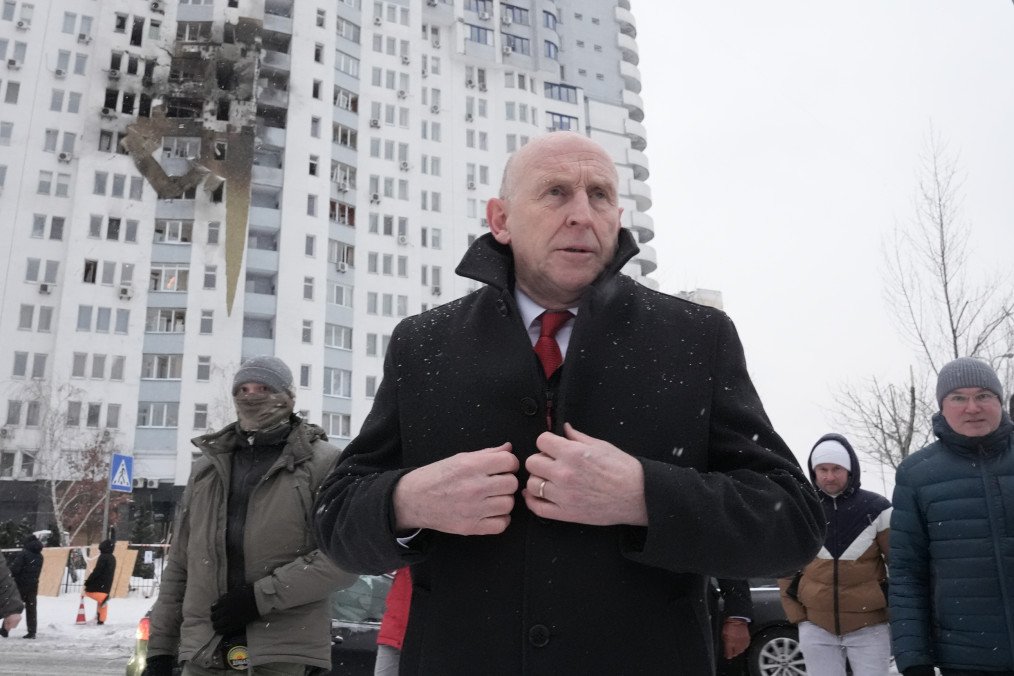 UK Defence Secretary John Healey inspects damage to a residential building hit by a Russian missile strike during a visit to Kyiv on January 9, 2026. (Source: Getty Images)