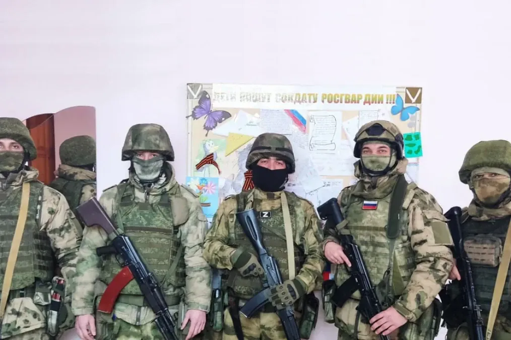 Russian soldiers pose for a photo during the Russian invasion of Ukraine.