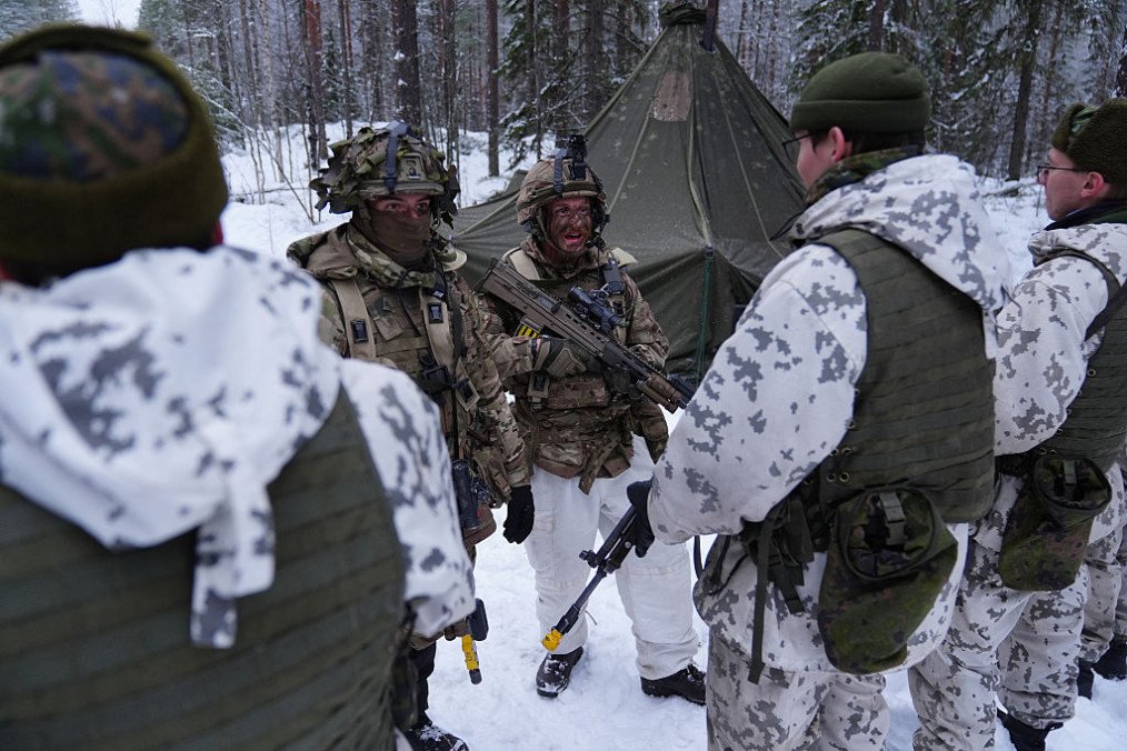 Corporal Reece Wilkinson-Wilson, 25 talks with Finnish Soldiers at Vuosanka near Kajaani as British soldiers train during a major exercise on NATO’s border with Russia. (Source: Getty Images)