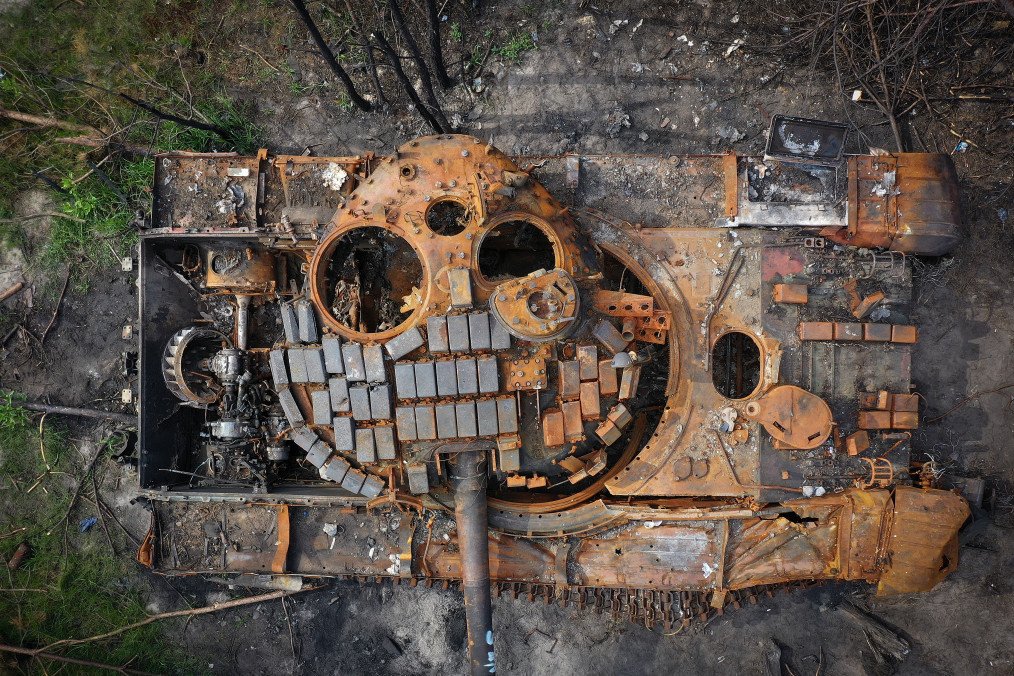 A destroyed Russian tank begins to rust in woodland near Kyiv on June 07, 2022, in Kyiv, Ukraine. (Source: Getty Images)