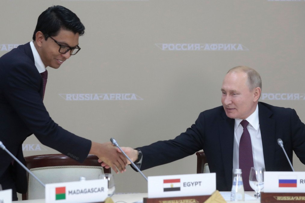 Russian leader Vladimir Putin shakes hands with the Madagascar president Andry Rajoelina during a meeting on the sidelines of the 2019 Russia-Africa Summit in Sochi on October 23, 2019. (Source: Getty Images)