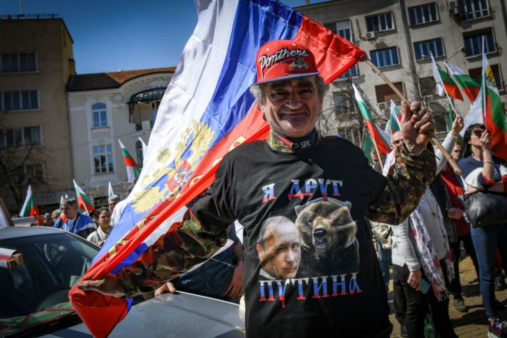 Man with t-shirt with Russian leader Vladimir Putin waves Russian flag during protest of nationalist and Russophile party of Vazrazhdane (Revival) in support of Russia. (Source: Getty Images)