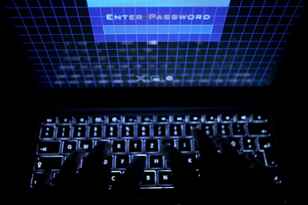 A person types a password on a laptop, as the screen reads “Enter Password.” Illustrative photo. (Source: Getty Images)