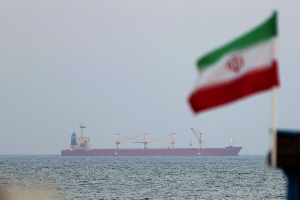 A picture taken on April 29, 2023, shows a shipping vessel sailing past Iran’s Gulf island of Qeshm. Illustrative image. (Source: Getty Images)