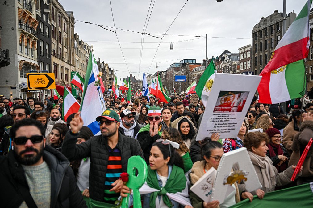 Anti-Iranian regime protesters march in Amsterdam on March 1, 2026, expressing support for US and Israeli strikes on Iran and for the killing of the country’s supreme leader. (Source: Getty Images)