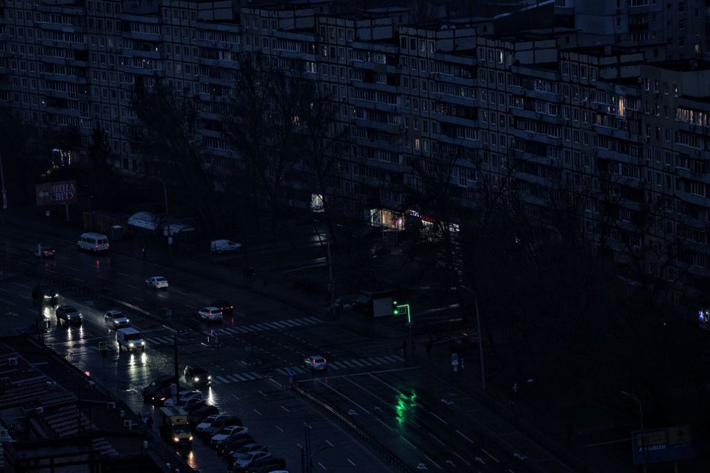 Cars move through a residential area of Dnipro during an evening blackout caused by a Russian attack, January 8, 2026. (Photo: Getty Images)