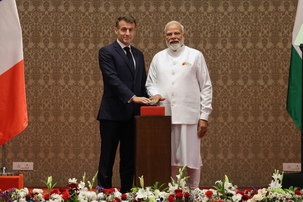France's President Emmanuel Macron and India's Prime Minister Narendra Modi press a button to virtually inaugurate the assembly line of Airbus H-125 helicopters, at a press event in Mumbai (Source: Getty Images)