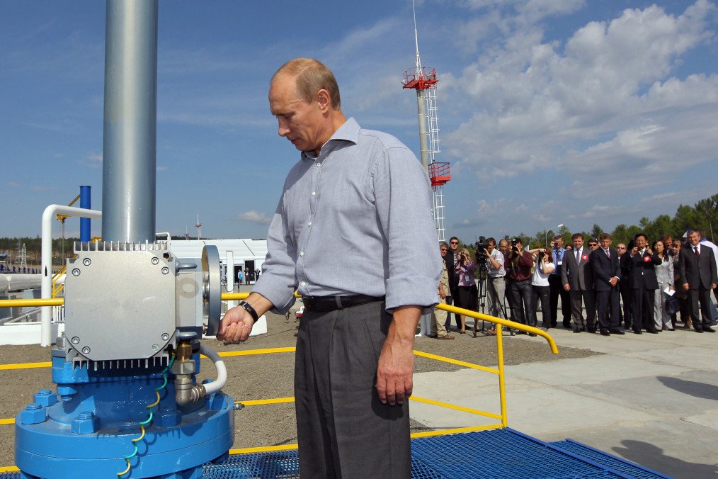 Russian leader Vladimir Putin opens a throttle during the opening ceremony for the Russian section of the Russia-China oil pipeline in the far eastern region of Amur on August 29, 2010