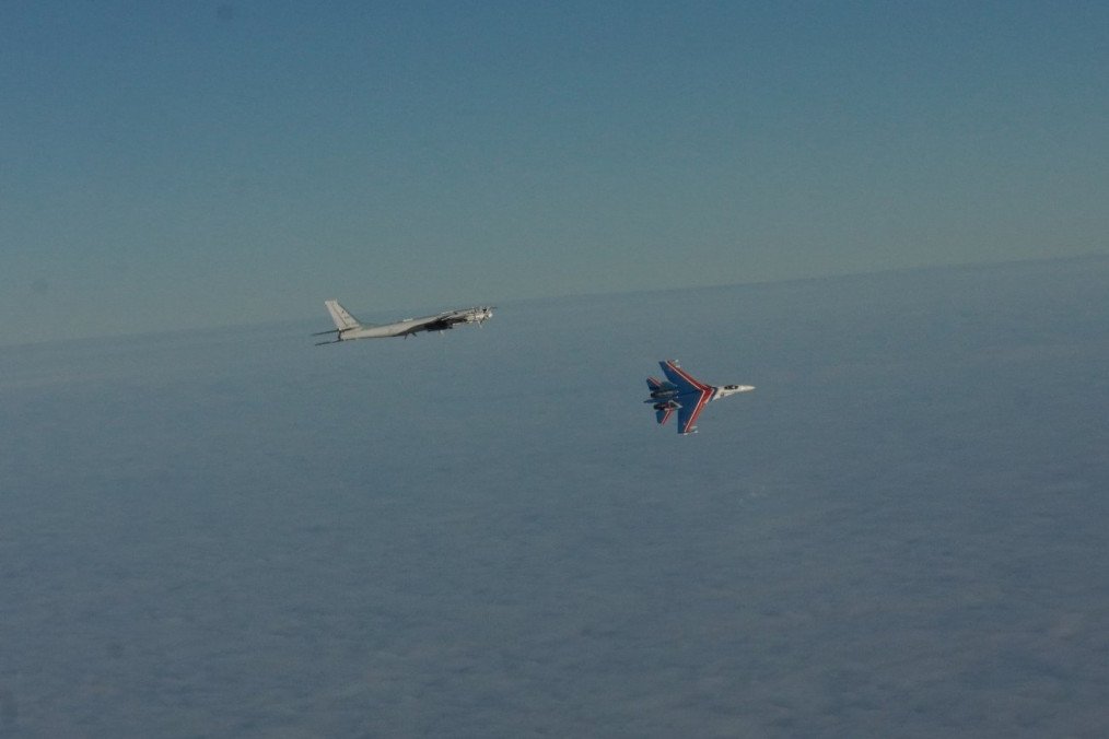 Russian Tu-95 Bear-H strategic bomber flies over the Barents Sea escorted by a Su-35 fighter jet painted in the colors of the “Russian Knights” aerobatic team. (Source: Norwegian Armed Forces)