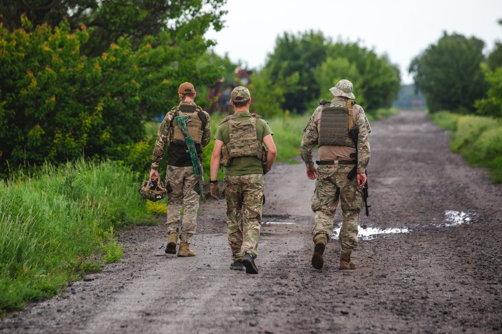 Ukrainian military members of the 116th Mechanized Brigade walk a dirt road in the Kupiansk direction on June 2, 2024 in Kharkiv Region. Illustrative image. (Photo by Arsen Dzodzaiev/Global Images Ukraine via Getty Images)