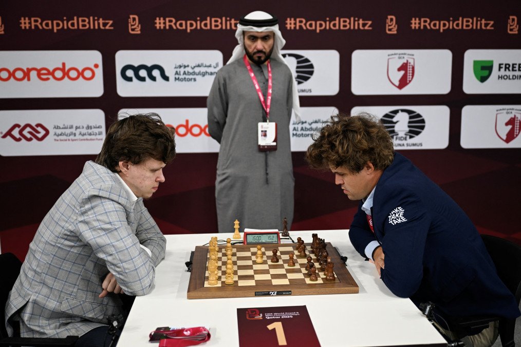 Russia's Vladislav Artemive plays against Norway's Magnus Carlsen during the first round of the FIDE World Rapid & Blitz Championships 2025 on December 27, 2025. (Source: Getty Images)