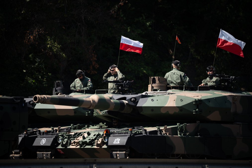 ‘Pre-War State’ Is Poland’s New Security Concept, With Warsaw Drafting Legislation to Counter Hybrid Threats Several Polish Army Leopard 2PL main battle tanks carrying Polish national flags. (Source: Getty Images)
