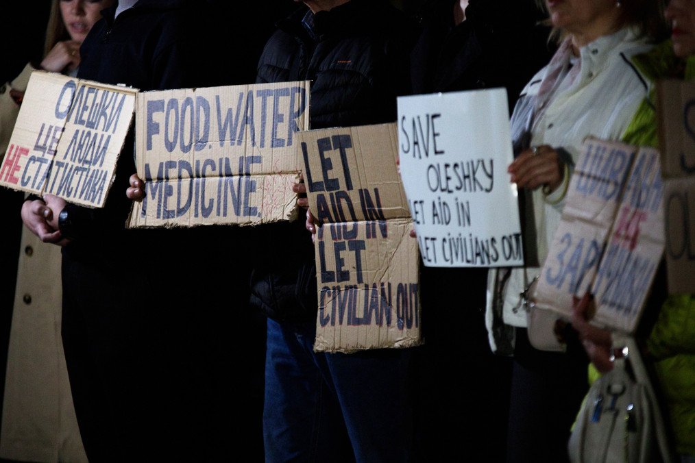 Activists hold placards with slogans during a rally in support of residents of Oleshky, Kherson region, near the diplomatic mission of the Holy See in Kyiv, Ukraine, on October 6, 2026. (Source: Getty Images)