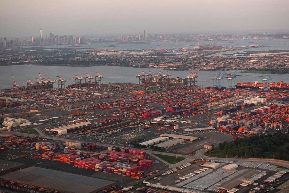 An aerial view of cargo ships being unloaded at Port Newark, in Newark, New Jersey, in front of the skyline of lower Manhattan in New York City on August 8, 2026. (Source: Getty Images) An aerial view of cargo ships being unloaded at Port Newark, in Newark, New Jersey, in front of the skyline of lower Manhattan in New York City on August 8, 2026. (Source: Getty Images)