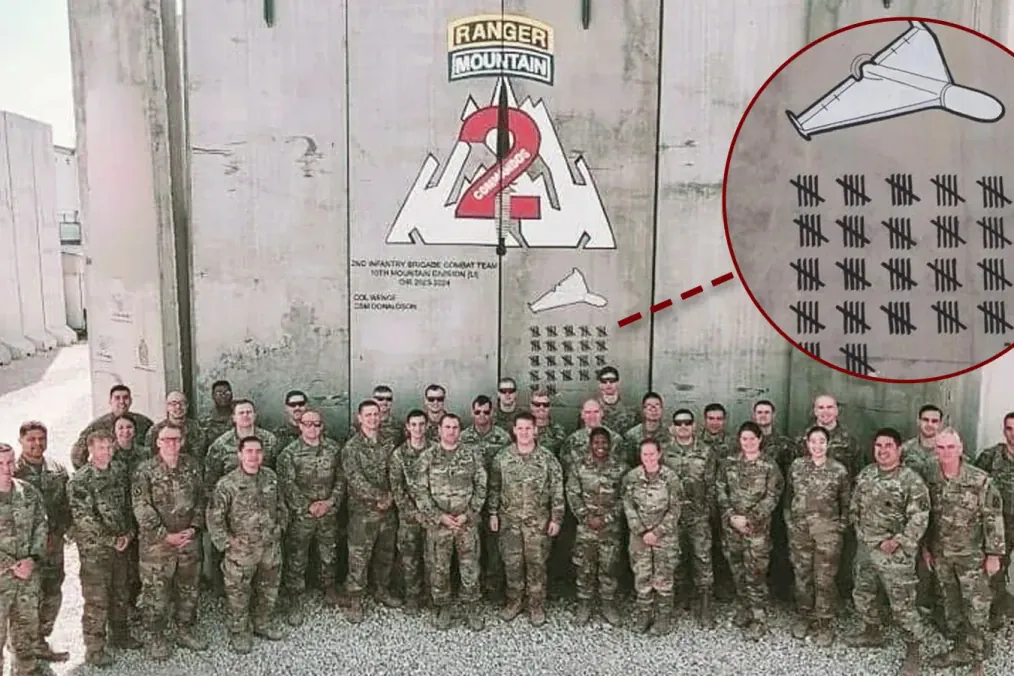 A US Army 10th Mountain Division soldiers pose near markings of the drones that were shot down. (Source: Task & Purpose)