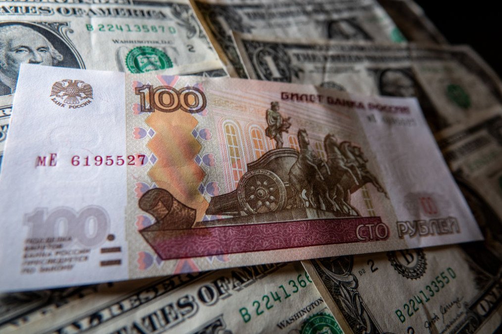 In this photo illustration, Russian rouble notes are seen besides one Dollar bill notes. (Source: Getty Images) In this photo illustration, Russian rouble notes are seen besides one Dollar bill notes. (Source: Getty Images)