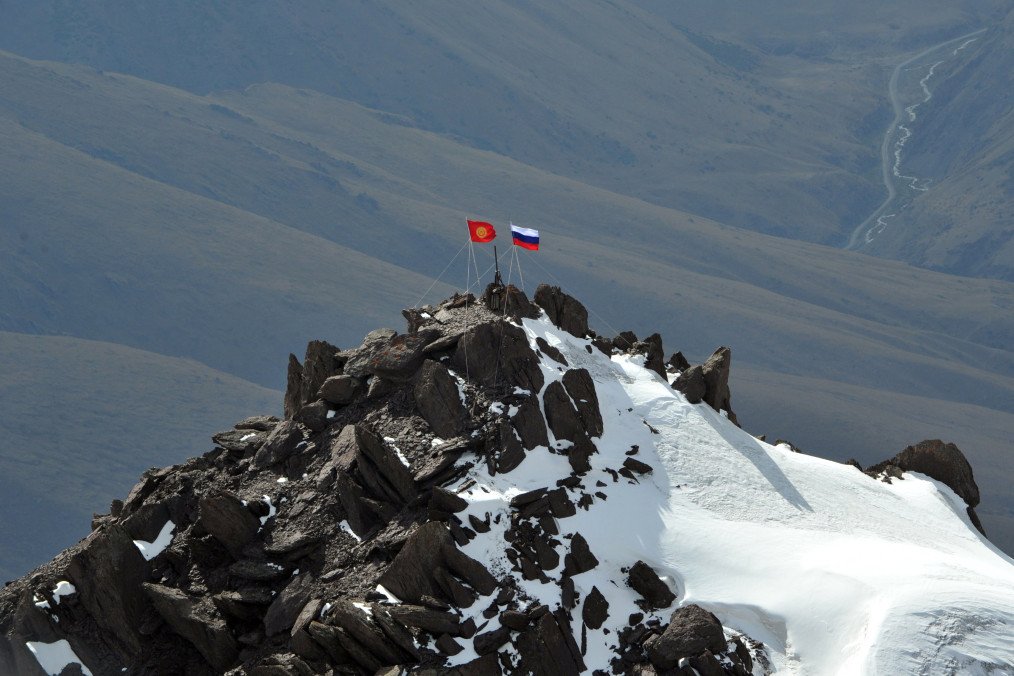 Russian and Kyrgyz flags displayed on Vladimir Putin Peak in the Tian Shan mountains near Bishkek, Kyrgyzstan. (Source: Getty Images)