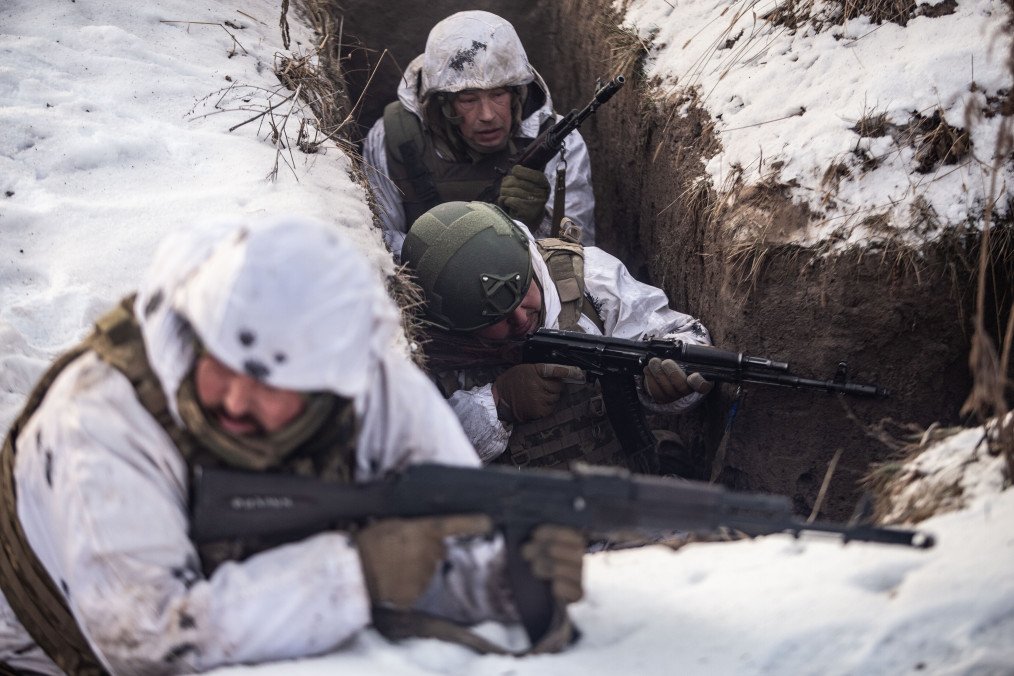 Soldiers in a trench assault maneuver during military training in Sumy, on January 19, 2026. (Source: Getty Images)