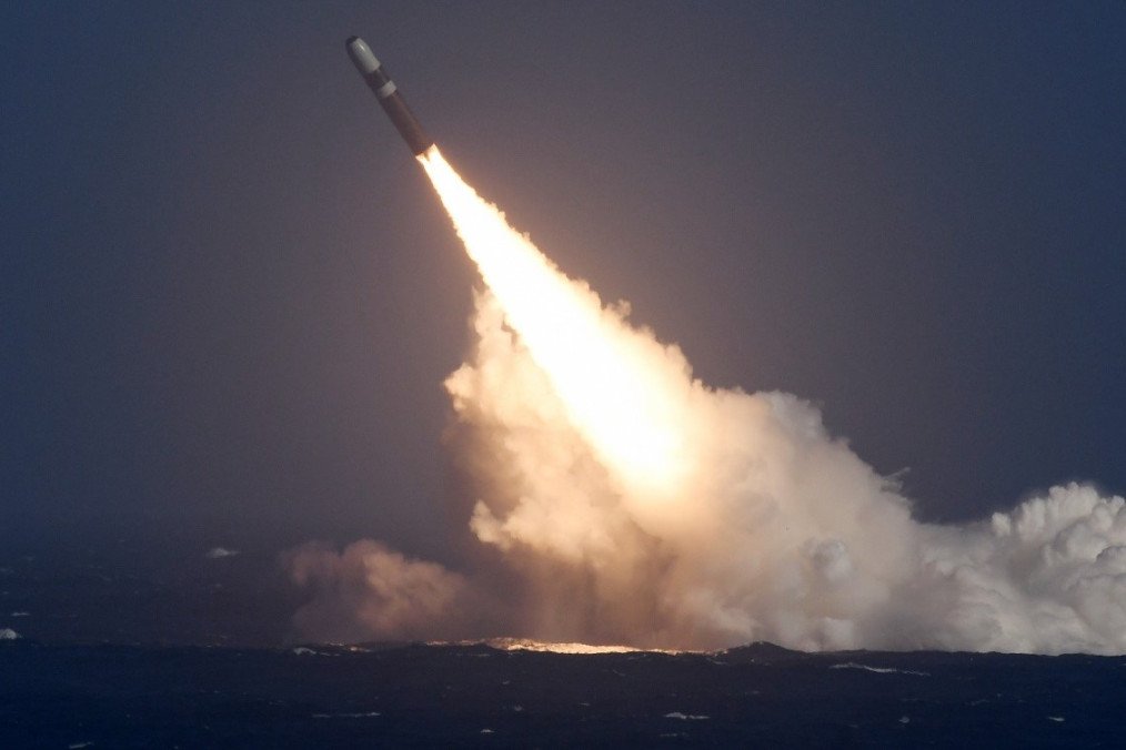 UGM-133 Trident II nuclear ballistic missile launch from a US Navy submarine. UGM-133 Trident II nuclear ballistic missile launch from a US Navy submarine.