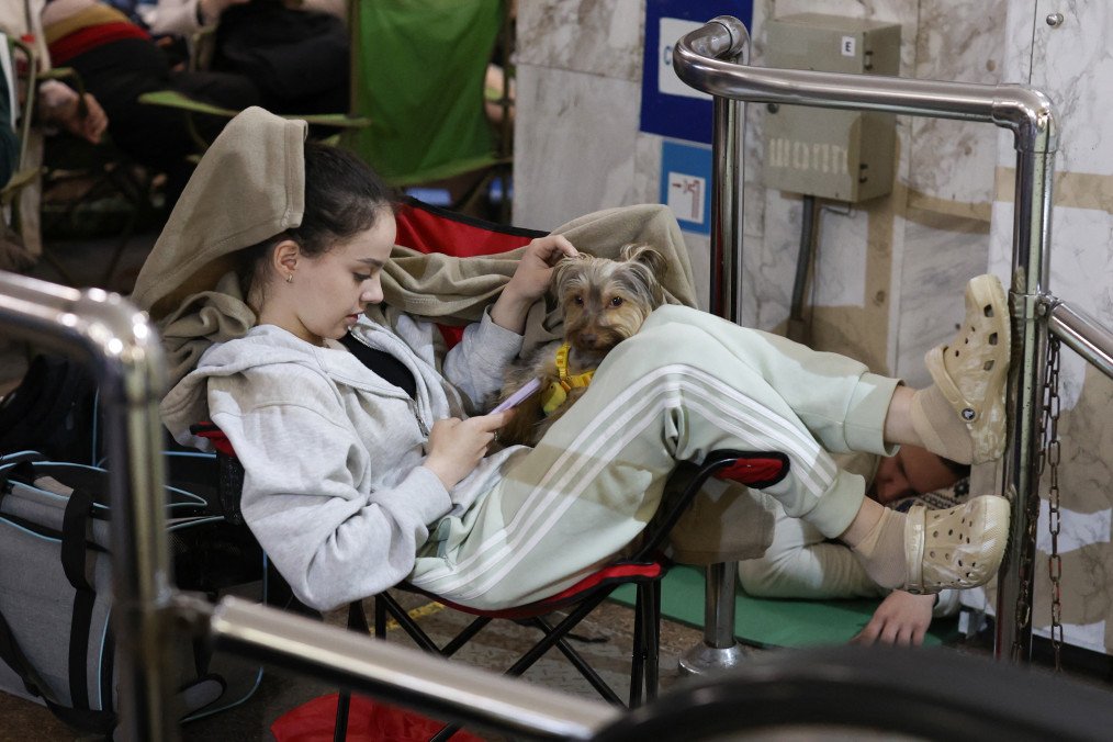 A woman shelters with her dog in a Kyiv metro station during a Russian missile and drone attack on June 15, 2026. (Source: Getty Images)
