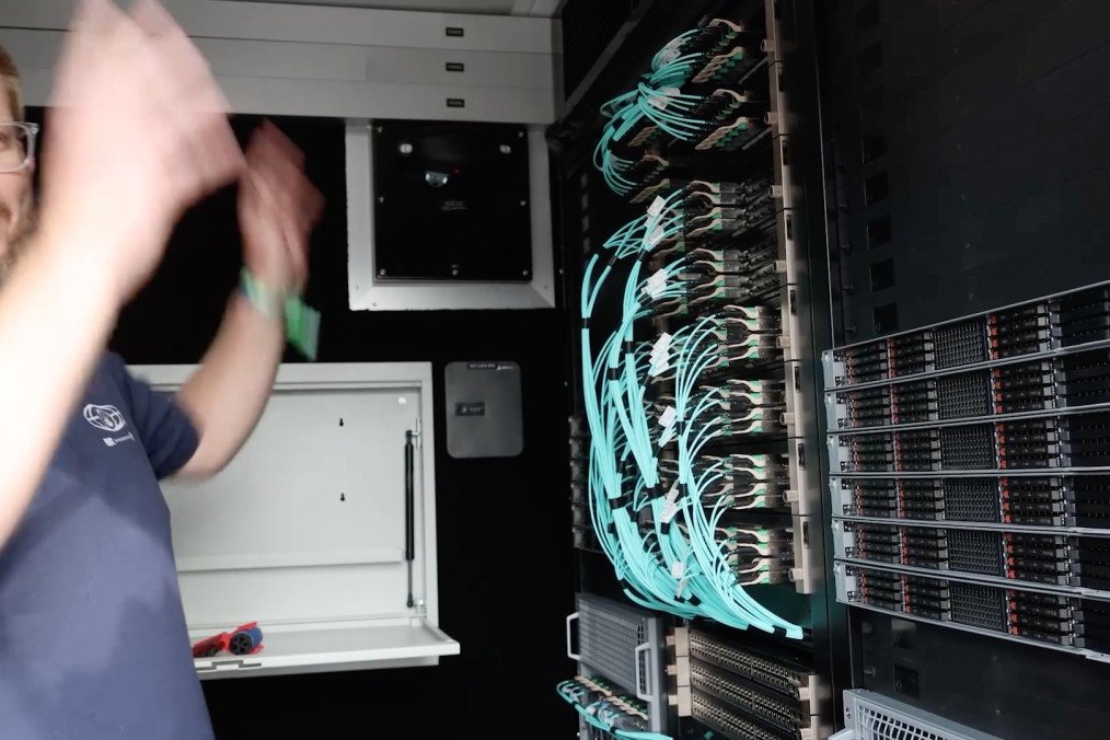 Chad Wahlquist, a Forward Deployed Architect at Palantir Technologies, is inside the containerized data center, July 2026.