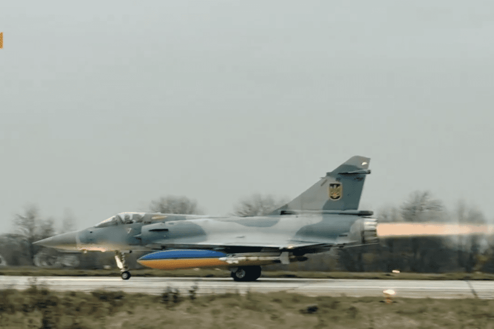 A Ukrainian Air Force Mirage 2000 takes off with afterburner, carrying a fuel tank in Ukrainian colors. (Source: Ukrainian Air Force)