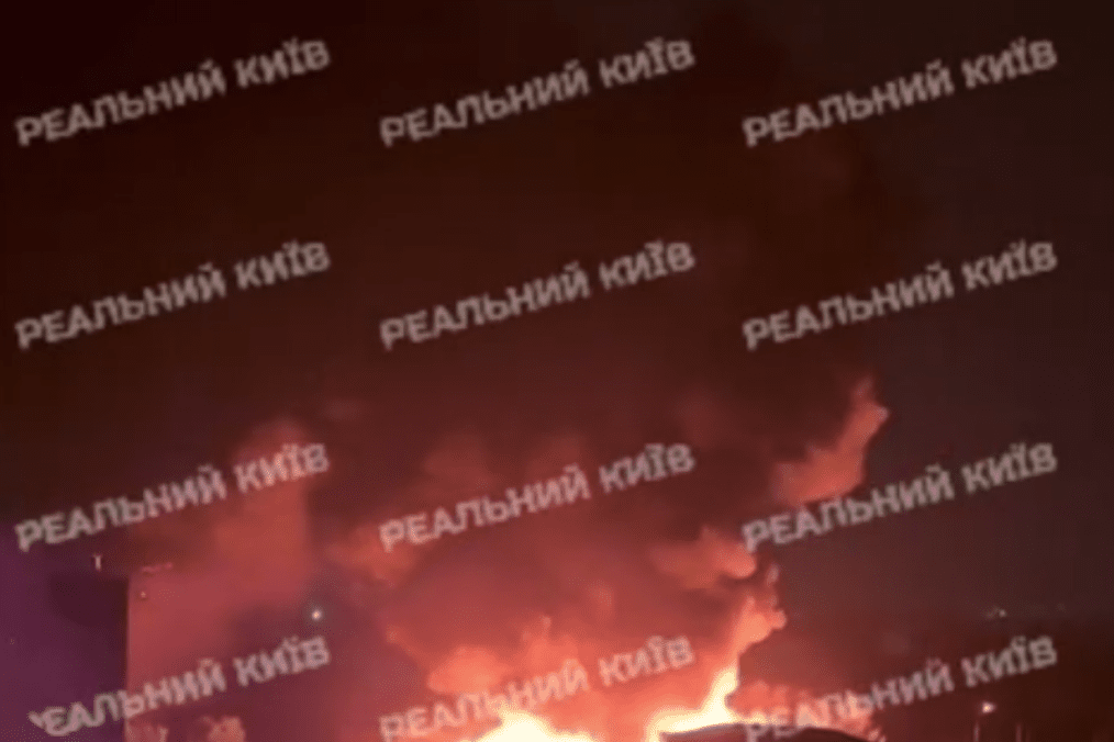 A close-up view at night shows a large fire with orange flames and thick smoke rising from an impact site after the Russian bombardment. (Source: Open Source)