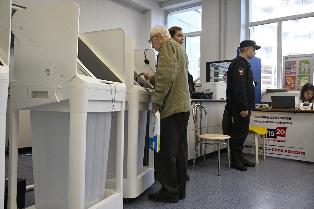 A man votes with an electronic voting system in Russia's parliamentary election at a polling station in Moscow on September 20, 2026.