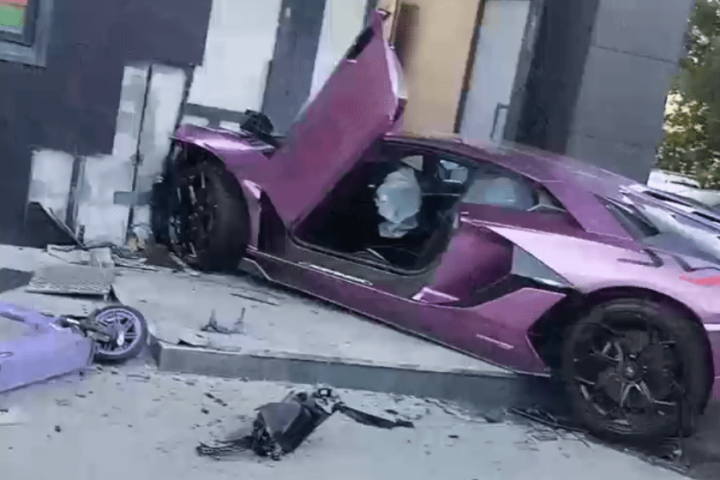 Purple Lamborghini registered to Russian oligarch Igor Altushkin sits crashed into a building entrance in Yekaterinburg, Russia. (Source: Russian media)