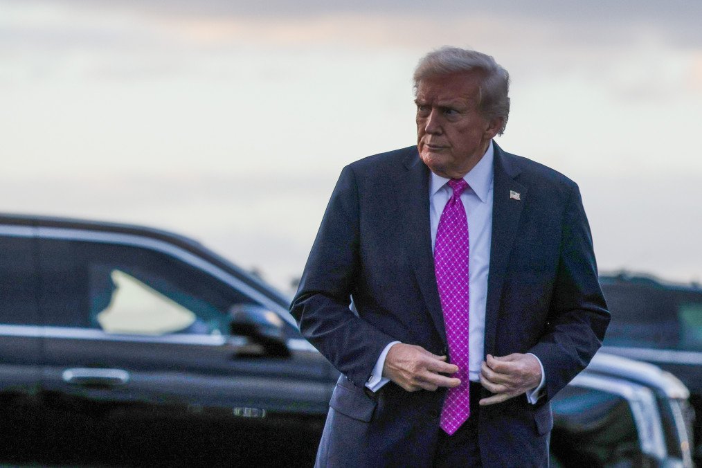 US President Donald Trump walks towards members of the press after he landed at West Palm Beach International Airport on October 17, 2025, in West Palm Beach, Florida. (Source: Getty Images)