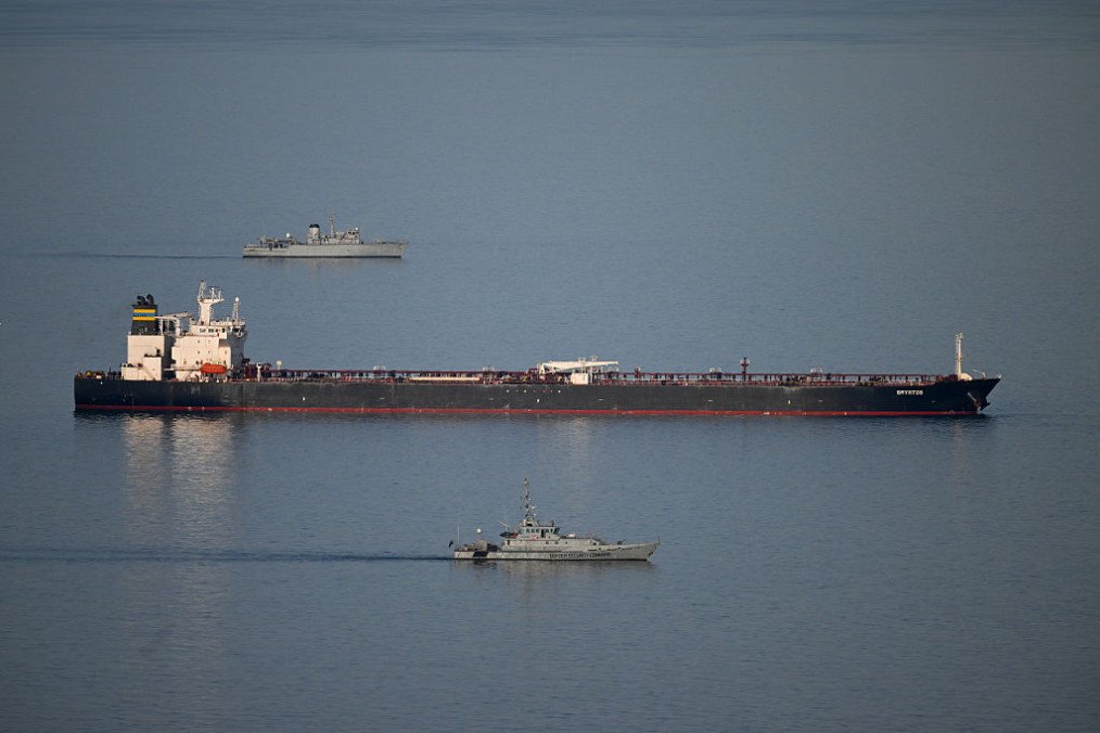 Military ships patrol the Smyrtos vessel outside the harbour, on June 14, 2026 in Portland, England. An oil tanker operating as part of Russia’s shadow fleet has been intercepted by British Forces in the English Channel. (Source: Getty Images)