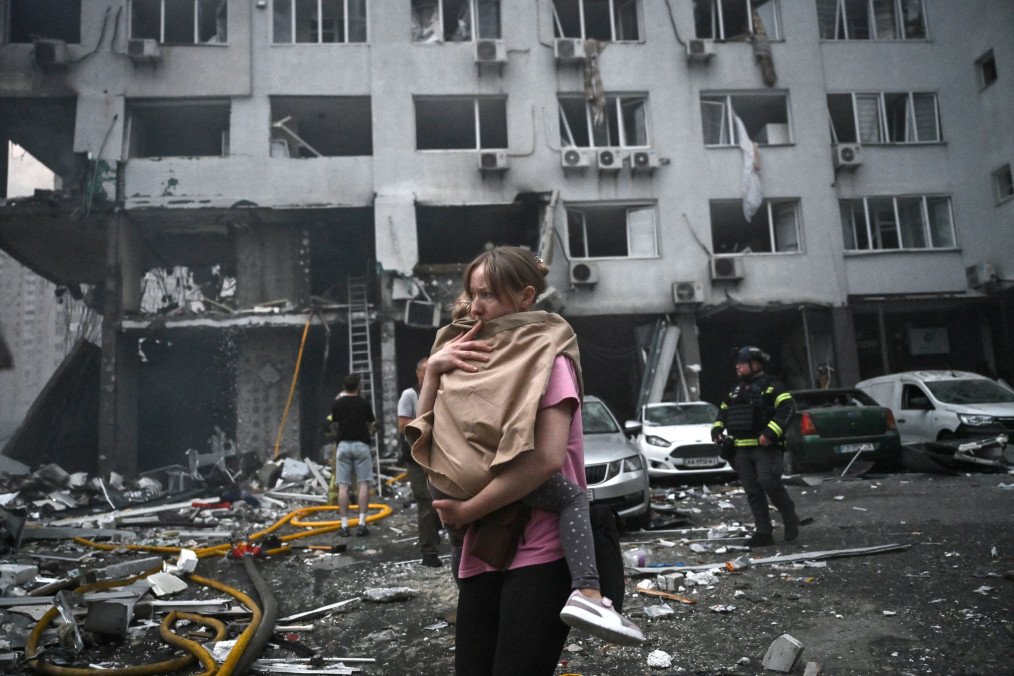 A woman holds her daughter outside a residential building damaged in a Russian ballistic missile strike on Kyiv, July 6, 2026. (Source: Getty Images) A woman holds her daughter outside a residential building damaged in a Russian ballistic missile strike on Kyiv, July 6, 2026. (Source: Getty Images)