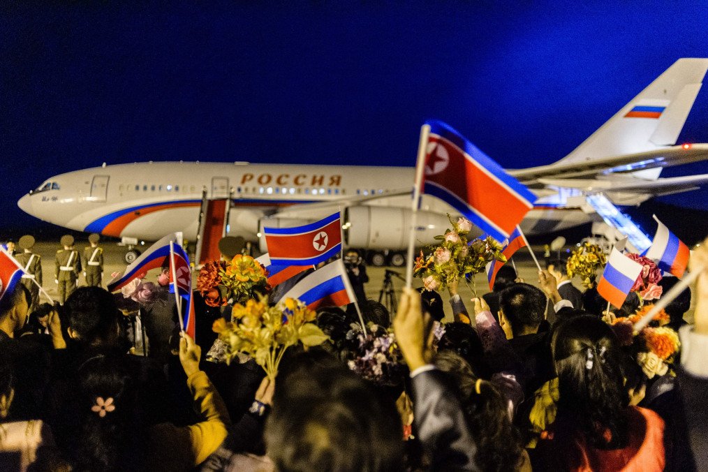 North Korean flags are waved as a plane carrying Russian Foreign Minister Sergey Lavrov prepares to depart from Pyongyang airport, October 19, 2023. (Source: Getty Images)