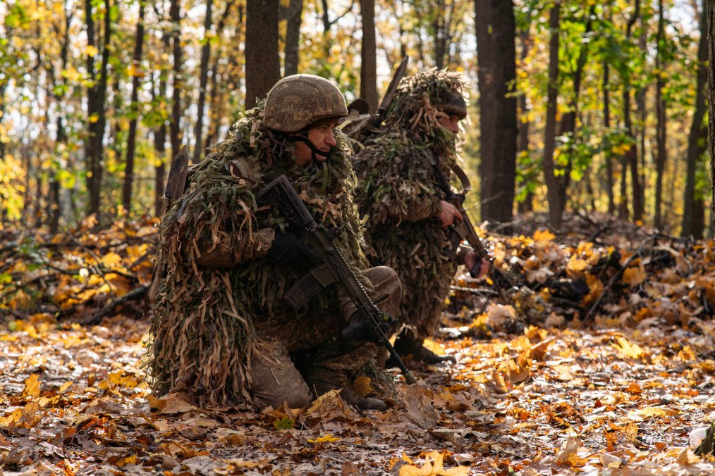Recruits of the 13th Brigade of the National Guard of Ukraine undergo field training alongside specialized drone operators near Kharkiv, Ukraine, on October 21, 2026.