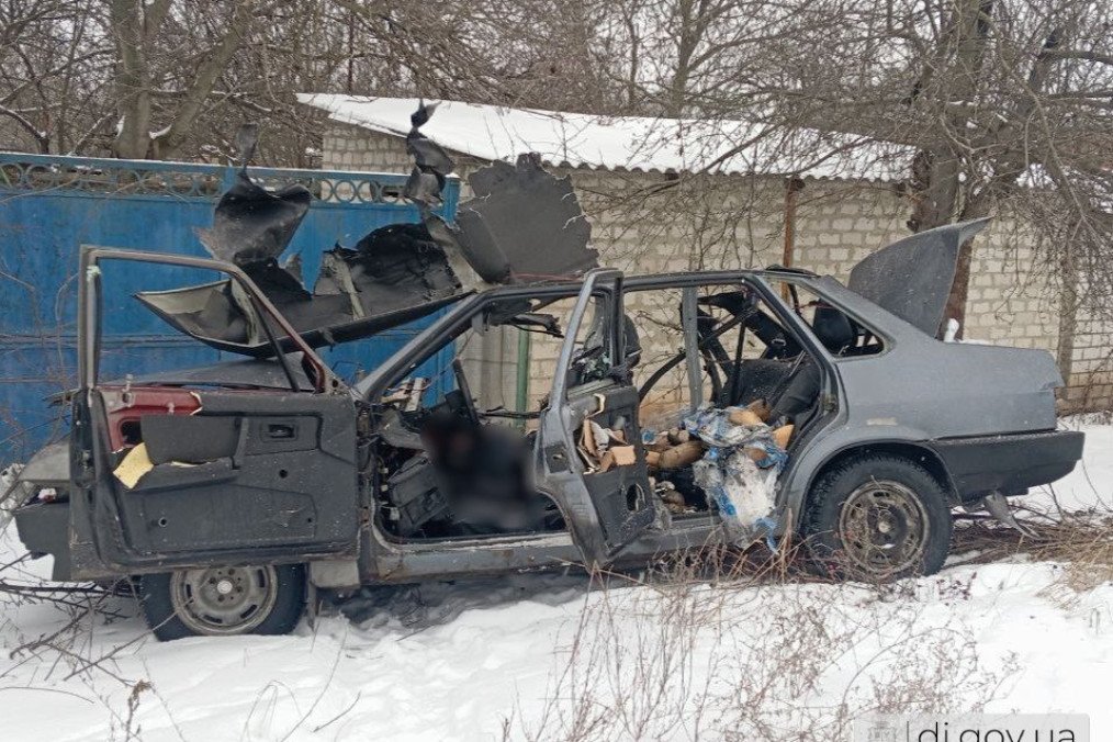 Russian FPV Drone Strikes Kill Two Volunteers in Kharkiv Region A destroyed vehicle with severely damaged sides, showing signs of explosion or heavy impact against a snowy backdrop, following the Russian attck. (Photo: Vyacheslav Zadorenko)