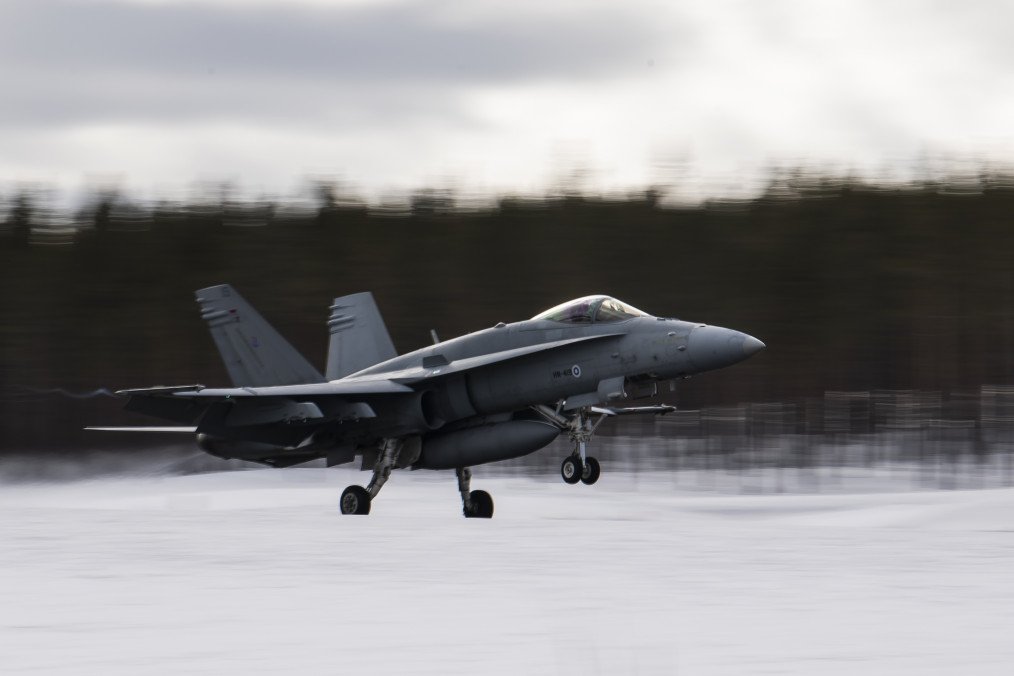 A Finnish F-18 Hornet lands at Jokkmokk Air Base during a joint exercise between the air forces of Finland and Sweden over the Arctic Circle on March 25, 2019.